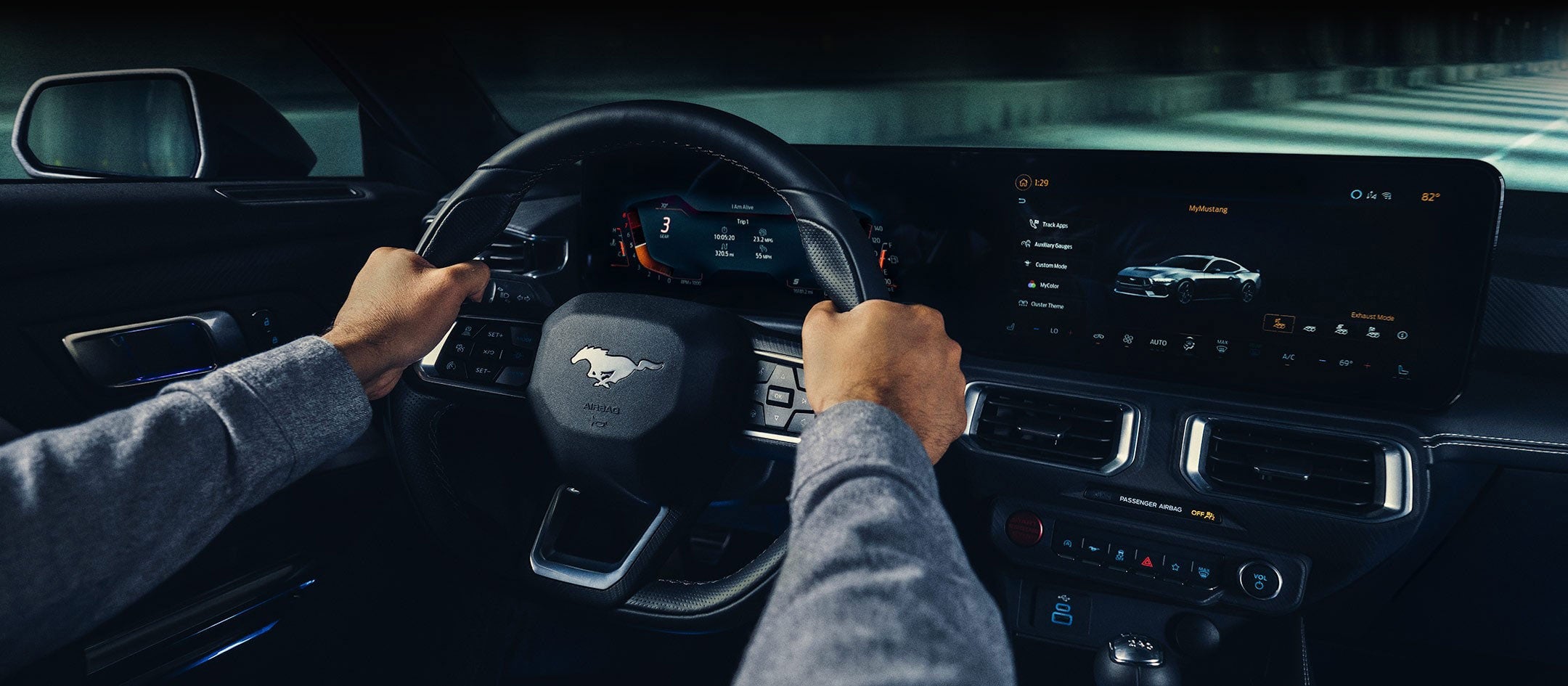 A 2024 Ford Mustang® model interior with a person driving | Glenwood Springs Ford, Inc. in Glenwood Springs CO